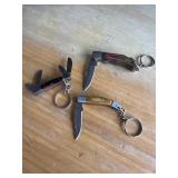 THREE FOLDING KEYCHAIN KNIVES