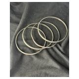 FOUR VINTAGE STERLING SILVER BANGLE BRACELETS