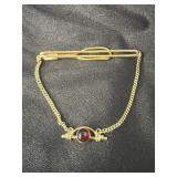 VINTAGE SWANK TIE BAR WITH RED STONE ACCENT,