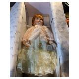 RUSTIE PORCELAIN DOLL FEATURES GLASS EYES, RED