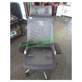 Rolling office chair with headrest