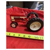 Farmall 404 toy tractor w/metal rear wheels