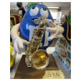 M & M Saxaphone player