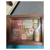 Shadow box w/ cigarette tins and match books