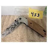 ELITE EGE STAINLESS STEEL W/WOLF ENGRAVING ON