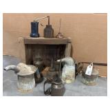Metal Oil Cans in wooden box