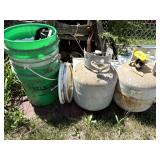 2 Propane Tanks & Stack of Plastic Buckets