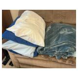 Pillows and Blue Plush Blanket