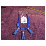 SUEDE TASSELS, BEADS, LARGE-CLASP NECKLACE