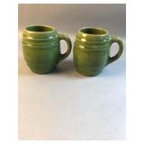 Pair McCoy Pottery green mugs #16 left one has