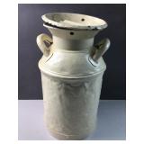 Well experienced milk can -- dents everywhere -