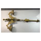 The ornate base of a ceiling fixture light