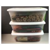 3 plastic containers with wooden toy parts and