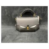 Black Leather-Style Handbag With Gold Trim