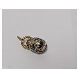 Gold Tone Turquoise Colored Egg Pendant