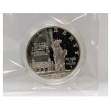 1986 Ellis Isl Comm 90% Silv $1 Dollar