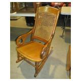 ANTIQUE OAK WICKER BACK ROCKER
