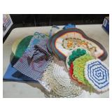 ASSORTED APRONS, POT HOLDERS, TABLE DOLLIES
