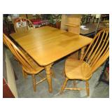 SOLID OAK DINING TBL W/(4) CHAIRS & LEAF