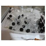COLLECTION OF CLEAN BOTTLES WITH LIDS