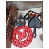 COLLECTION OF TRIVETS & HEART SKILLET