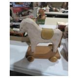CARVED WOOD HORSE ON WHEELS