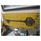BIG METAL KEY ON WOOD