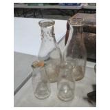 4 EMBOSSED VTG MILK BOTTLES