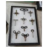 COLLECTION OF CLOCK KEYS IN CASE