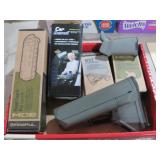 COLLECTION OF GUN GRIPS AND CAR ARMREST