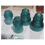 COLLECTION OF VINTAGE GREEN GLASS INSULATORS