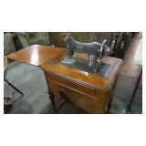 ANTIQUE DOMESTIC SEWING MACHINE IN CABINET