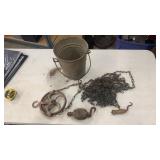 Antique well bucket with metal pulley and wooden