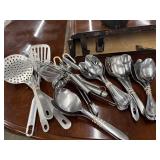 Bundle of stainless steel kitchen utensils.