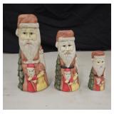 3 Ceramic Santa candle holders.