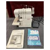 3 pc.Singer Ultralock sewing machine and gloves