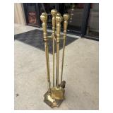 Vintage, solid brass fireplace tools featuring a