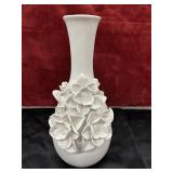 white ceramic vase featuring a handcrafted peony
