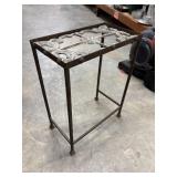 Rustic wrought iron accent table with a
