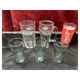 Bundle of Coca- Cola tall and small glasses .