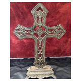 cast iron table top cross with ornate cutouts and