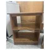 Small, oak-finish wooden bookshelf with two open