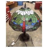 Tiffany-style table lamp featuring a green and