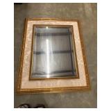 Vintage gold-gilt beveled wall mirror featuring