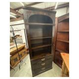 Dark wood Ethan Allen bookcases in a traditional