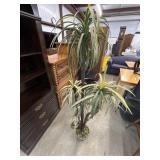 Artificial dracaena tree designed for home decor.
