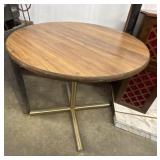 Kate and Laurel Solvay round side table with a