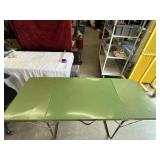 Green Foldable camping table.a little rusted in