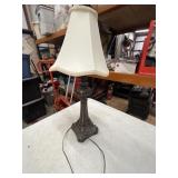 Vintage-style table lamp with an ornate, cast