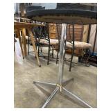 Round Table With A Tinted Glass Top